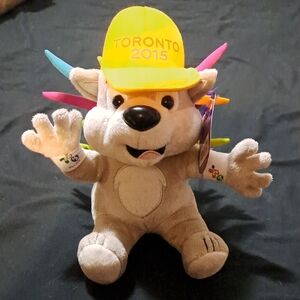 Tan Stuffed Animal with Yellow Hat and Colorful Spikes